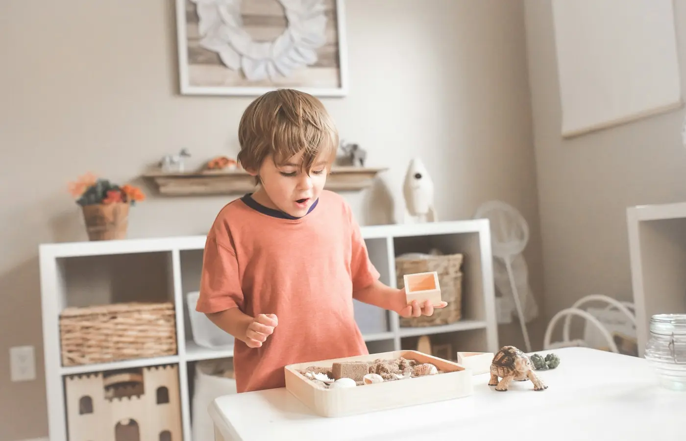 Child using shallow toy bins