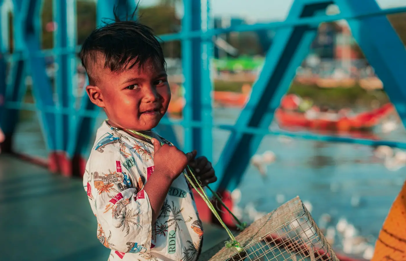 Child carrying a basket of toys