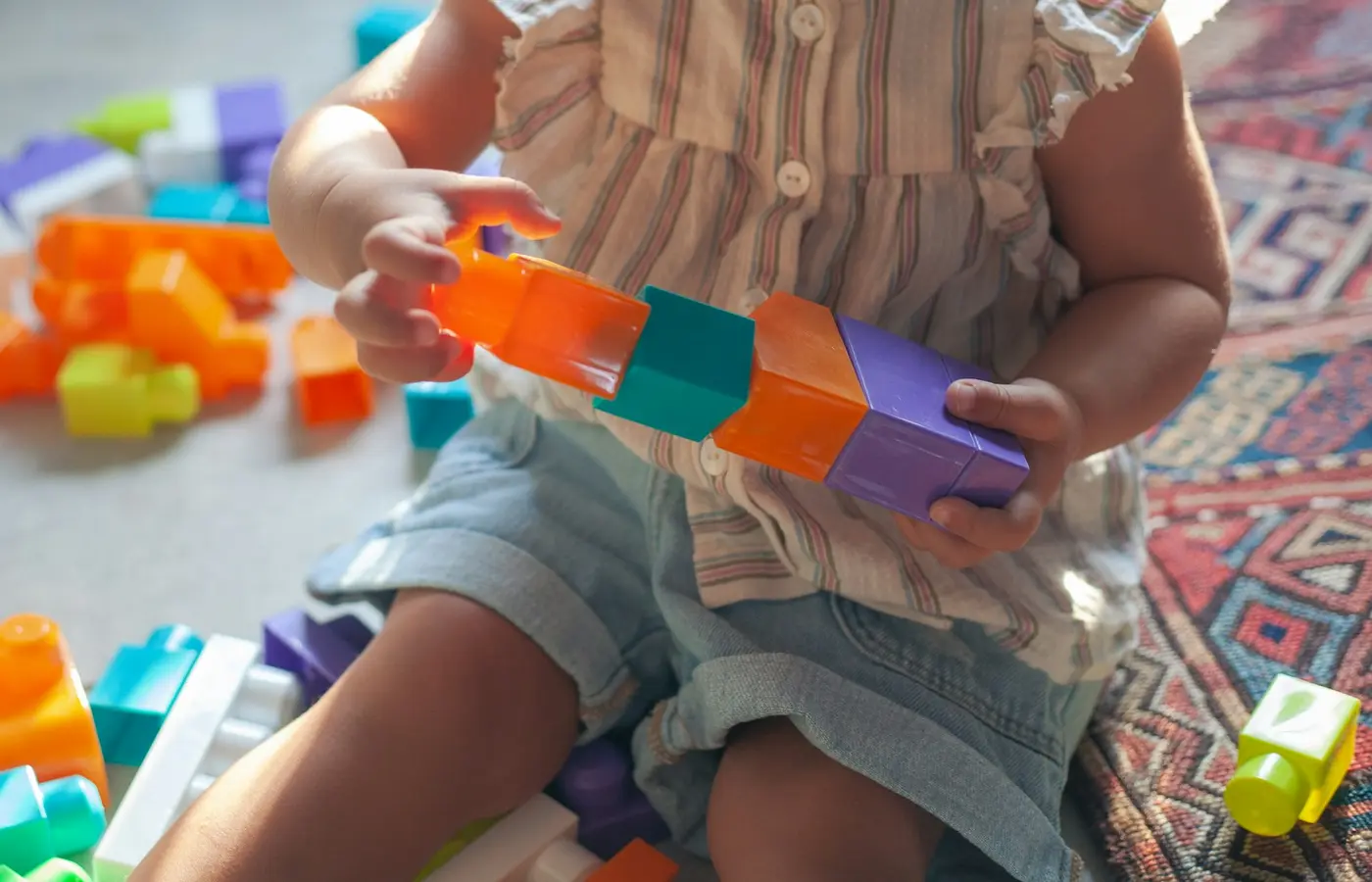 Child building with interlocking bricks