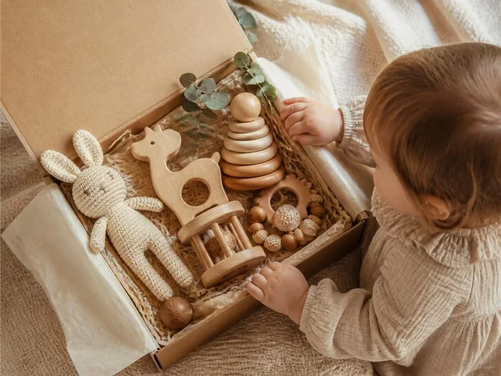 A thoughtfully arranged set of natural wooden toys ready to be gifted